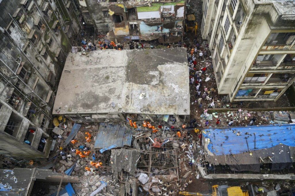 Thane: National Disaster Response Force (NDRF) and Fire brigade carry out rescue operation after a three-storeyed building collapsed, at Bhiwandi in Thane district, Monday, Sept. 21, 2020. (PTI Photo)